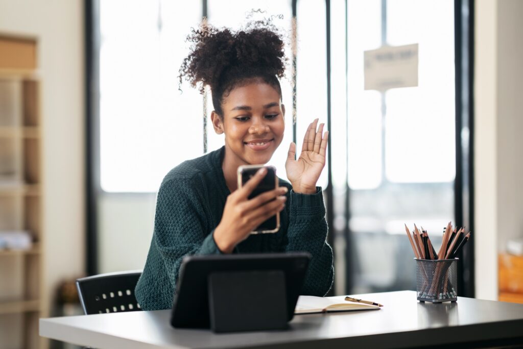 African american student woman in sweater video conference on sm