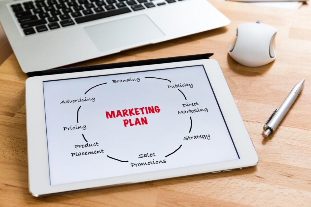 Business office table with table pc presenting marketing planning