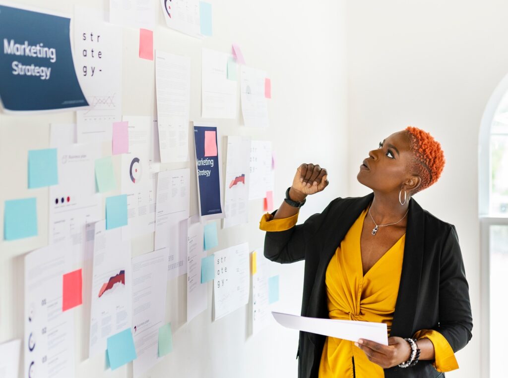Cool black businesswoman planning a marketing strategy