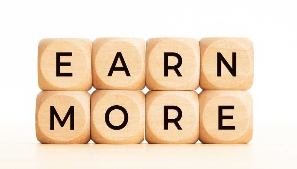 Earn more phrase on wooden block shape
