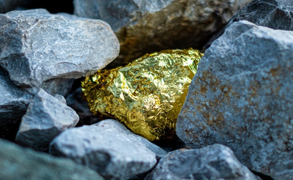 a gold nugget in a pile of rocks