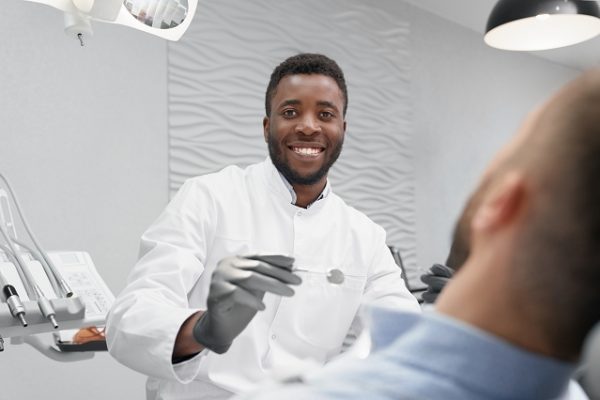 African Dentist treats a patient