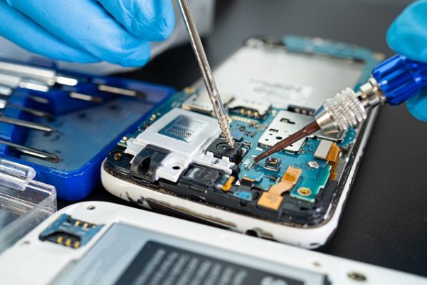Technician-repairing-inside-of-mobile-phone-by-sol-2023-11-27-05-08-44-utc